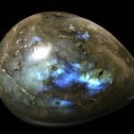 Photo of an egg-shaped labradorite rock